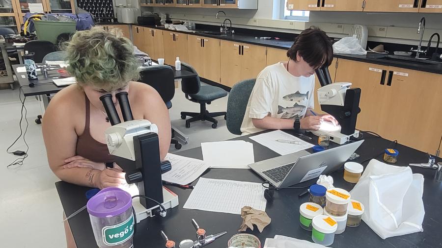 Abi Cherry and Norah Shires in a biology lab