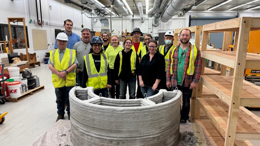 People work with concrete printed planter