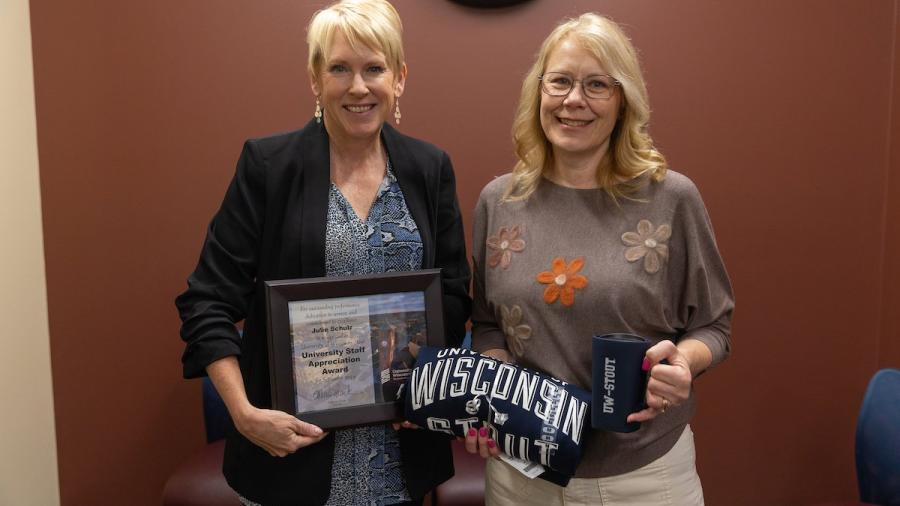 Two women with award