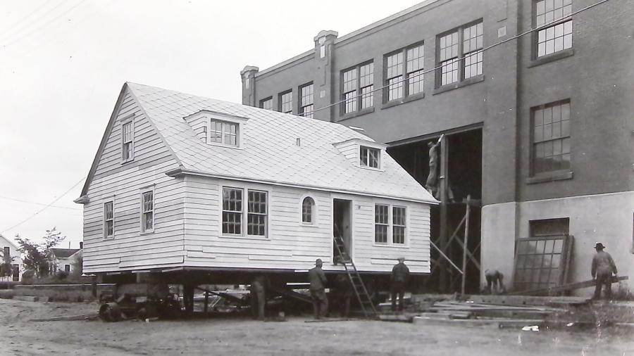 Ray Hall and a home being transported