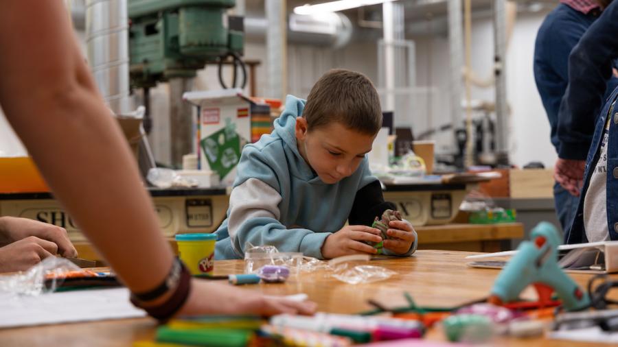 Engineering students designing manufacturable toys with kindergartners