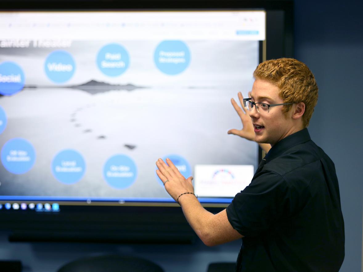 Tyler Elwood speaks in a class at UW-Stout. He and teammate Jack Moore took first place in computer network design in a national collegiate competition.