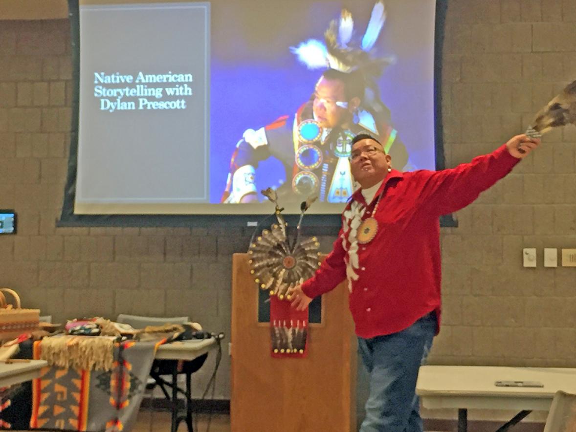Dylan Prescott shared stories of the Ho-Chunk people at UW-Stout as part of Native American Heritage Month and used an eagle feather during one story.