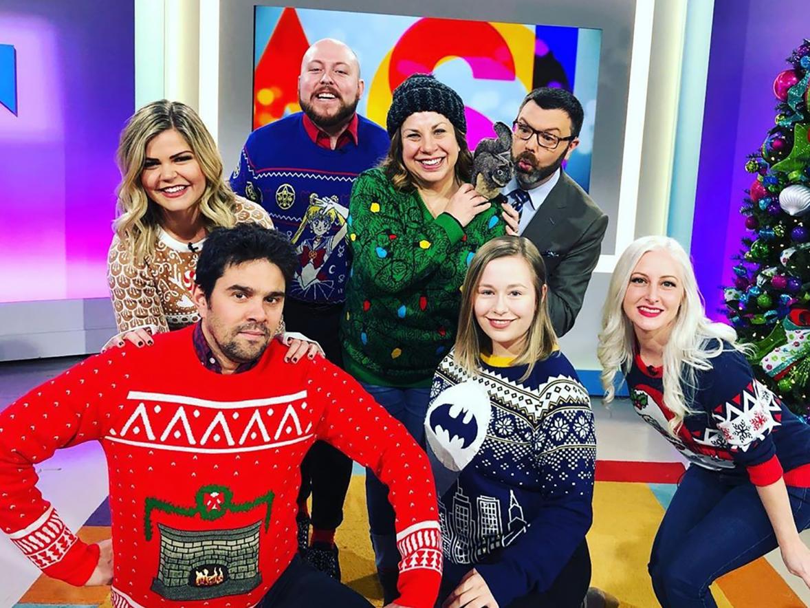 UW-Stout apparel design alumnus Kurt Anderson, third from left, wears his “Sailor Moon” ugly Christmas sweater recently on the Twin  Cities “Jason Show.” Anderson was a guest on the show promoting Fun.com’s holiday sweaters.