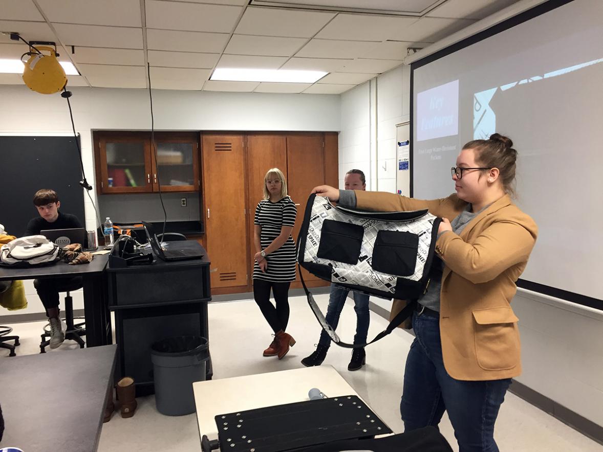 UW-Stout student Emma Smerud shows the Ruffle Bag, a convertible pet and duffle bag. Apparel design and development students create fuctional, yet trendy backpacks and pet carriers. UW-Stout photos by Pam Powers