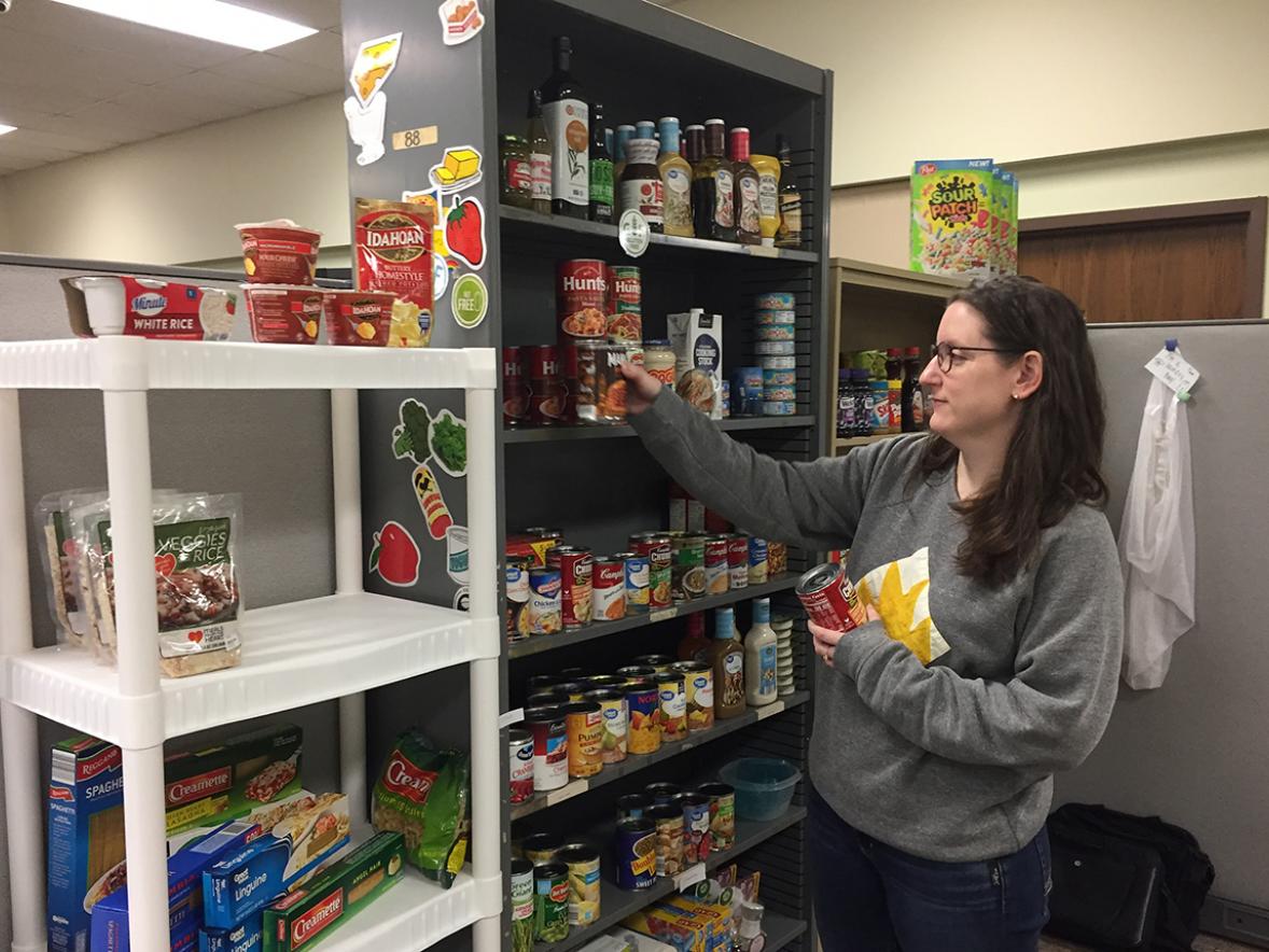 Sarah Snyder, Helping Hand food pantry plus coordinator, organizes food at the pantry. Students in need of items from the pantry can arrange a package pickup through the Dean of Students’ office.