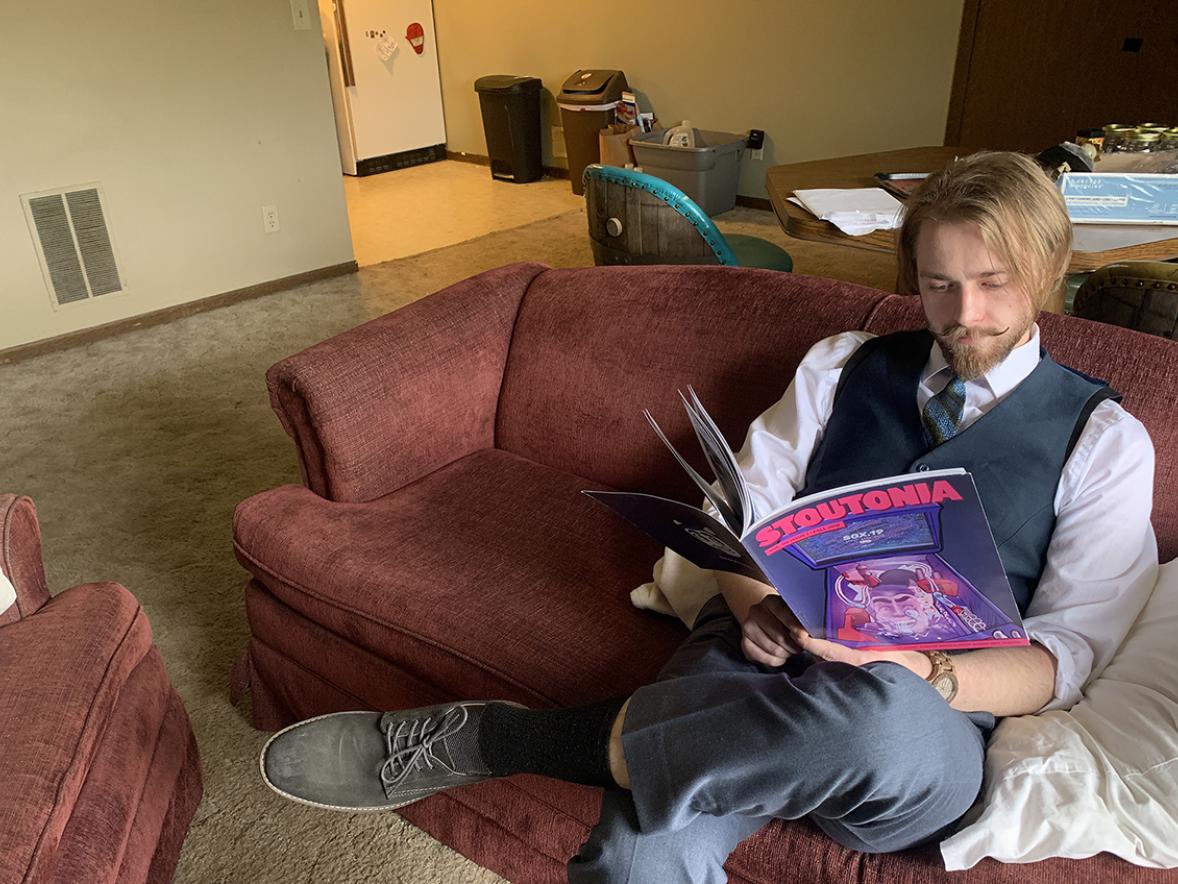 Bryce Parr, editor-in-chief of the Stoutonia, looks over the latest edition. The student news source created a digital publication this semester.