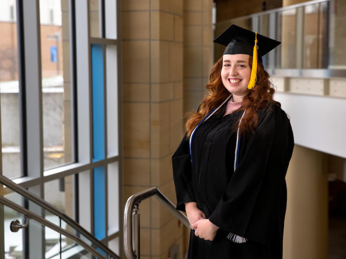 Erica Gaetz, human development and family services graduate, pictured in the Memorial Student Center grand stairwell.