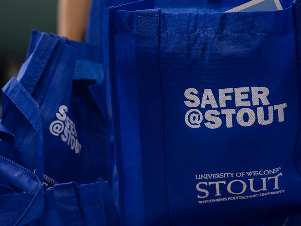 Knock and Talk initiative volunteers will be giving students bags filled with information on staying safe, coupons and free items. / UW-Stout photo by Chris Cooper