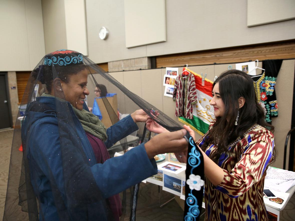 Nilu Umarova in 2018 at an International Education Week event showing traditional Tajikistan dress.