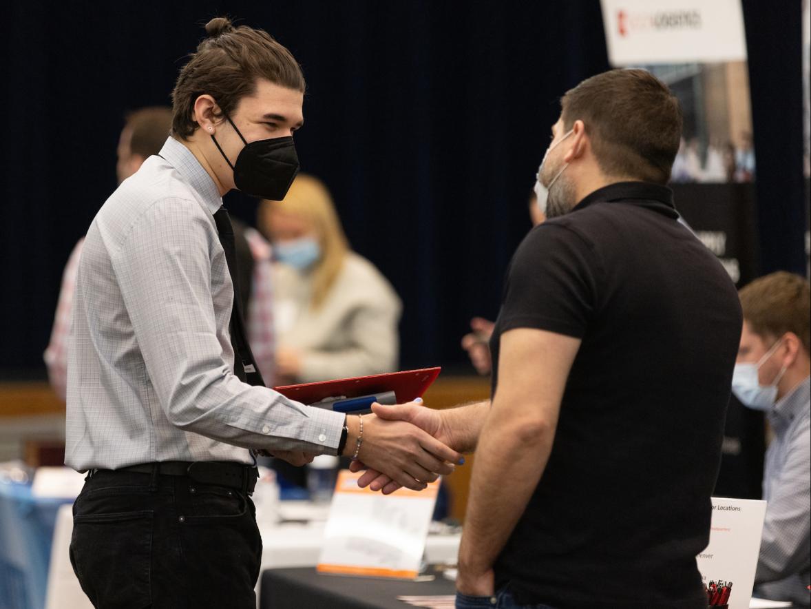 A UW-Stout student meets an employer recently at the Spring Career Conference. 