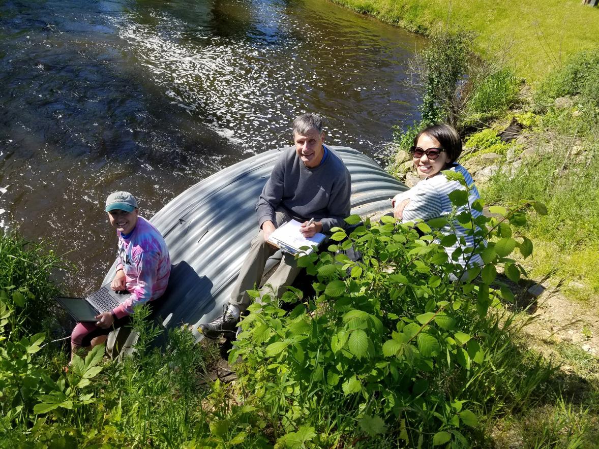 From left, intern Heidi Lieffort, CLRR Director Bill James and CLRR Manager Mai Lia Vang sample water from Horse Creek, which flows into Cedar Lake in Polk County.