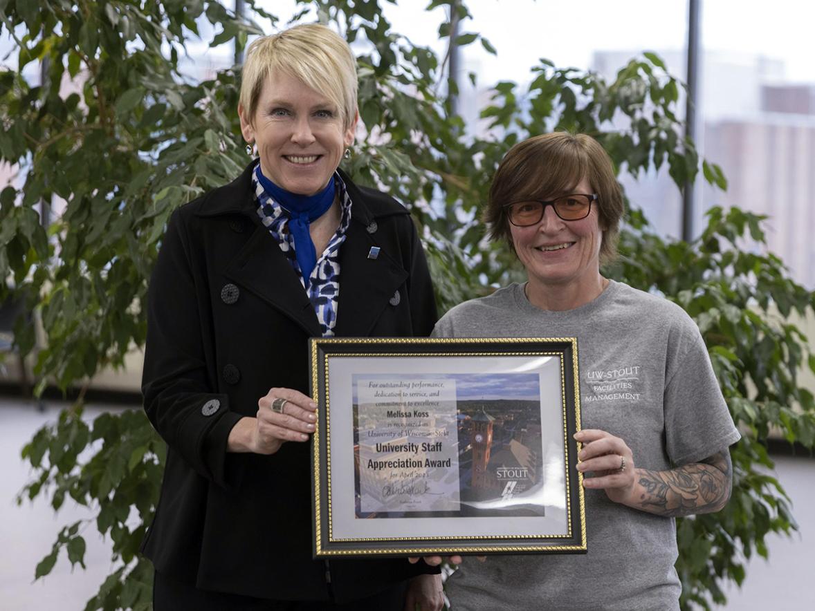Melissa Koss, right, receives the April University Staff Employee Appreciation award from Chancellor Katherine Frank.