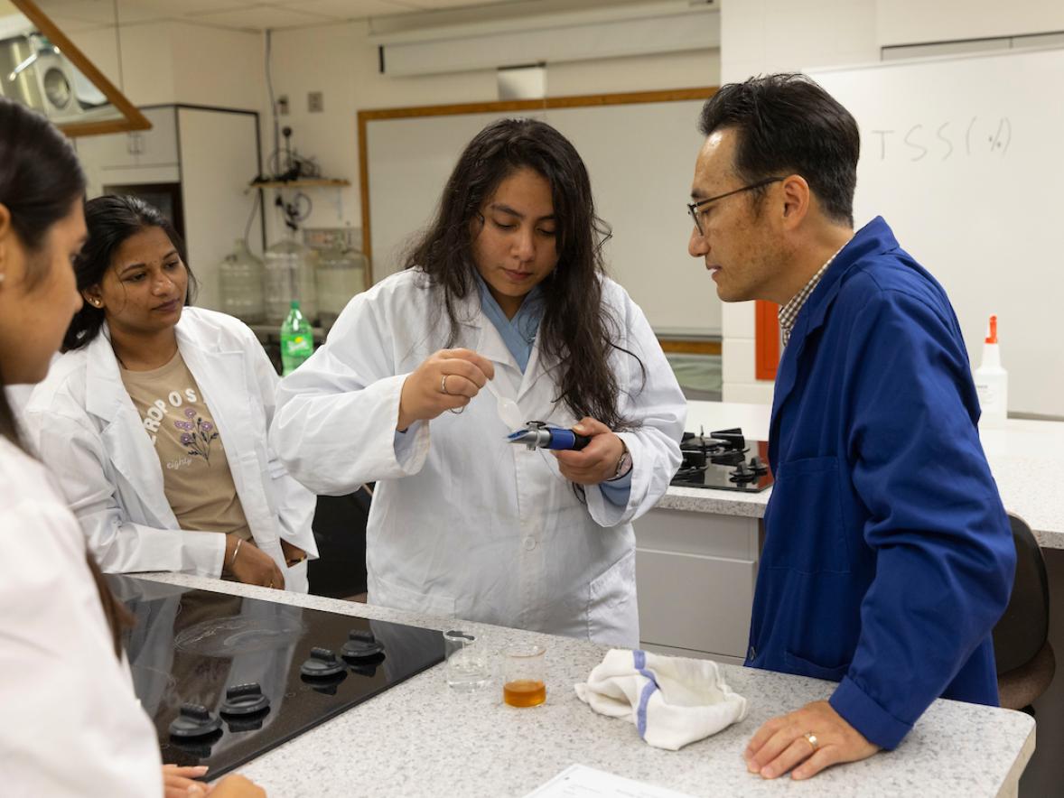 Food science students conduct glucose test in the lab