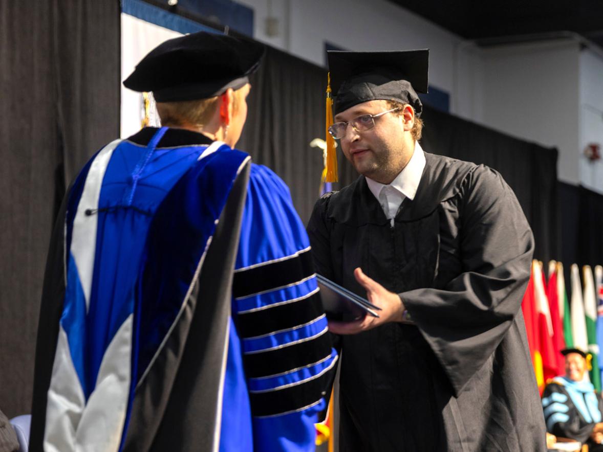 Man receiving diploma
