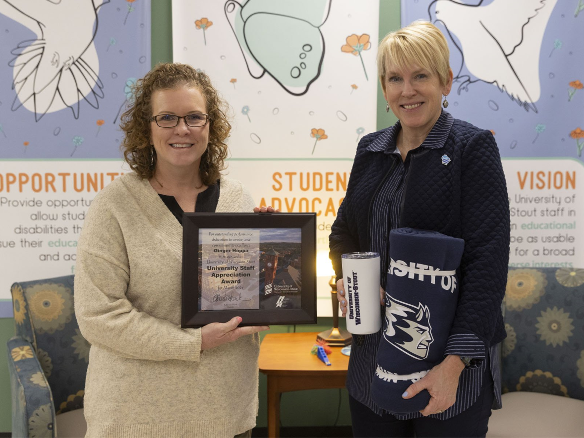 Two women with award