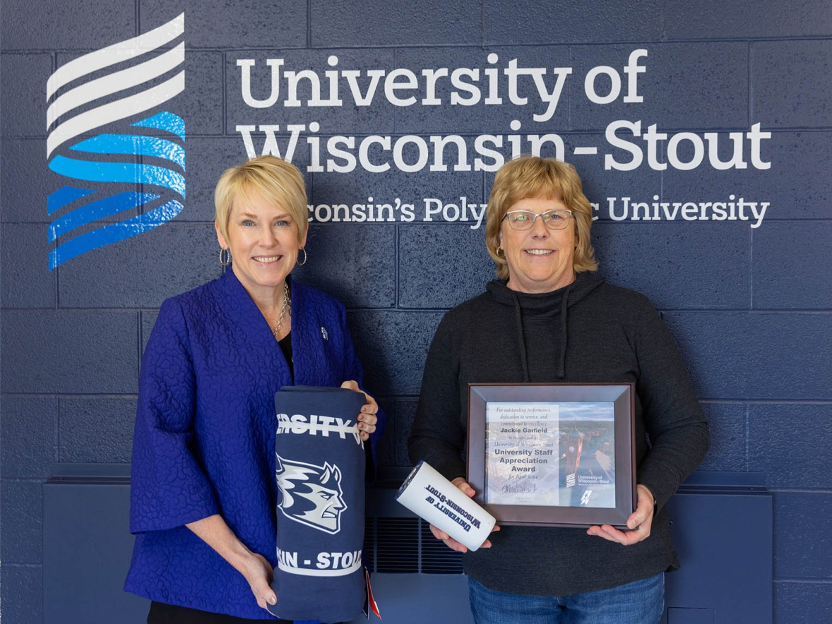 Two women with award