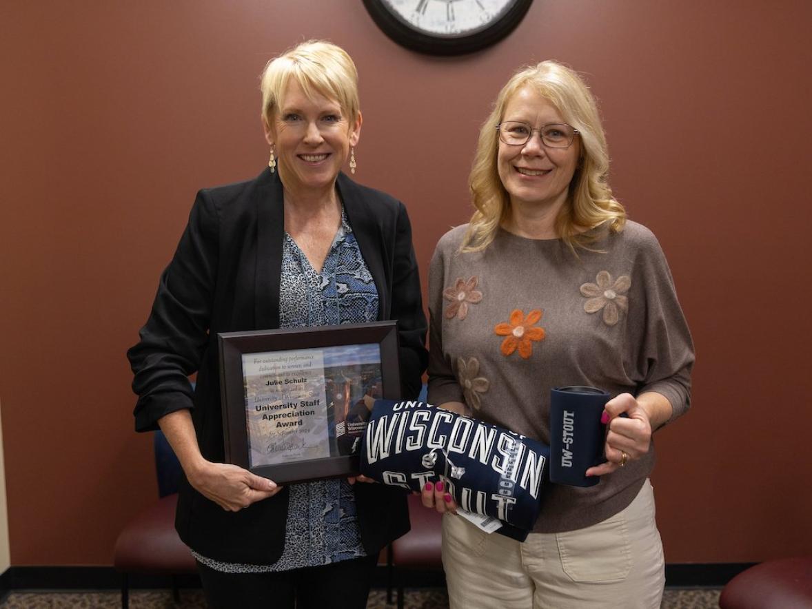 Two women with award