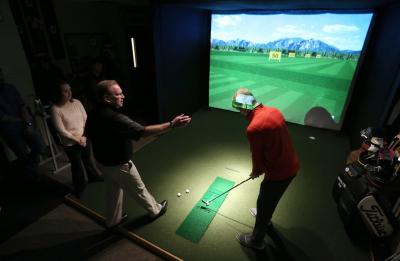 Golf Enterprise Management students complete a practical exam in the golf simulator lab during Assistant Professor Howie Samb's Fitting and Swing Analysis class in Heritage Hall
