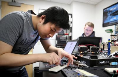 Physics students work in labs in Jarvis Hall.