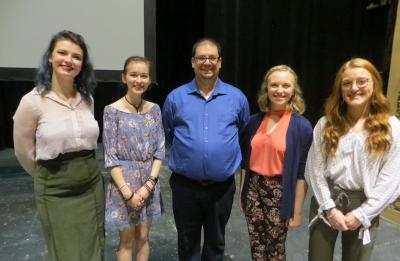 Stephanie Howell, Gabrielle Grzona, Professor Richard Schutta, Elsbeth Bandli and Jordyn Danielson on the Havry Hall Theatre stage.