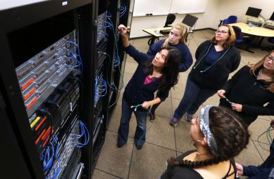 CNIT Program Director Holly Yuan and students.