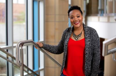 Mary Daye, rehabilitation services graduate, in the grand stairwell at Memorial Student Center.