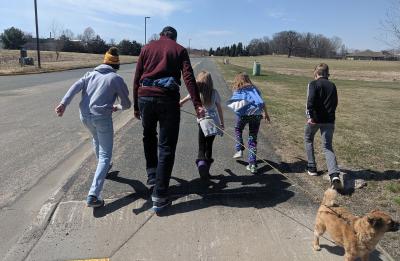 PCEM Professor Mitch Ogden on a walk with his children and dog.