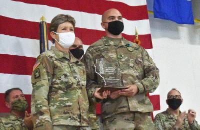 Grant Kjellberg, UW-Stout criminal justice and rehabilitation major, receives the Wisconsin National Guard Wortham Award recently at Volk Field from Brig. Gen. Joane Mathews, Wisconsin’s deputy adjutant general for the Army.