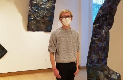 Studio arts senior and gallery assistant Beck Slack in Furlong Gallery.