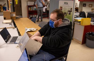 Student working on candy dispensing maching.