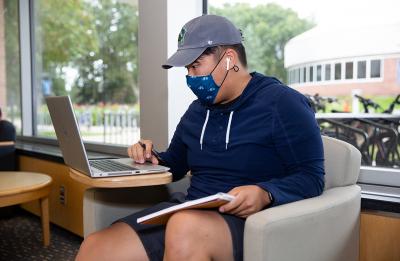 A student studying on campus.