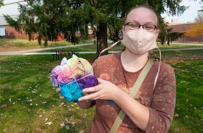 Student tie dyeing on campus.
