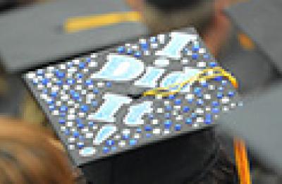 A graduation cap personalized with "I did it!"