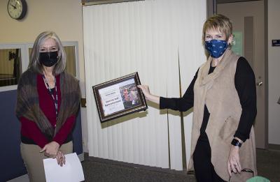 Chancellor Katherine Frank, at right, presents the January University Staff Employee Appreciation Award to Doreen Johnson in Human Resources. /UW-Stout photo by Ryan Dolan