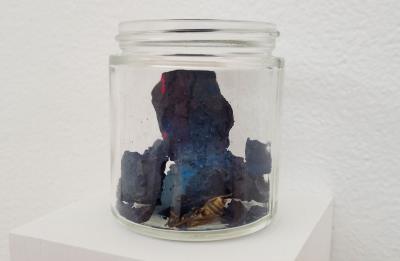A hornet and ochre potter's clay turned dark blue through an oxidation process by Beck Slack.