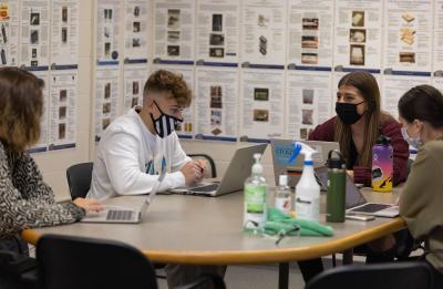 Students Piers Rimmereide, Lance Anderson, Maggie Kendhammer and Jasmine Bussie in the GNC course.