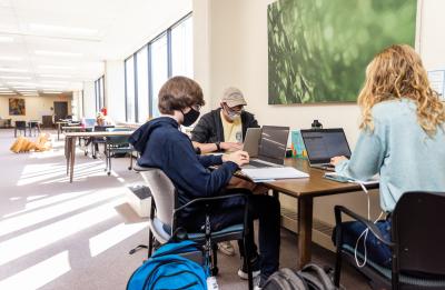 Students studying on the 4th floor of the University Library.