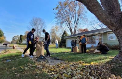 Students helping with community fall clean up.