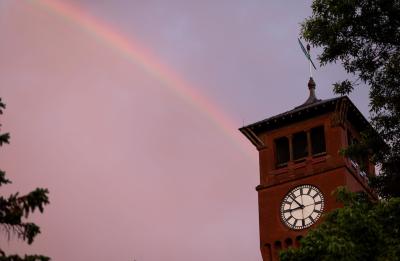A rainbow arcs over the Bowman Hall Clock Tower after a June rainstorm.