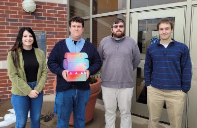 Students Mallorie Mackie, Vaughn Vande Walle, Elliott Nelson and Mike Cops with their packaging sub-brand "Aroma Sanctuary."