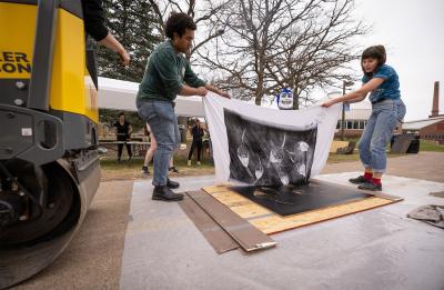 Revealing a print after being pressed.