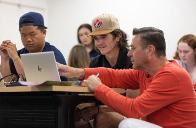 First-year students meeting with Adviser James Arenz and registering for classes at FYRO.