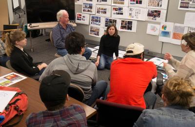 Kim Loken, center, and game design students.