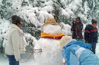 Students building snowman