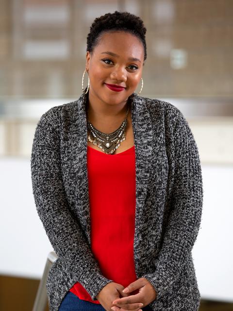 Mary Daye, rehabilitation services graduate, pictured in the grand stairwell at Memorial Student Center.