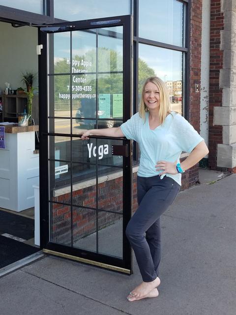 Photo of Rachel Funk-Johnson in front of Happy Apple Therapy Center