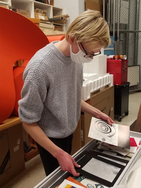 Studio arts senior and gallery assistant Beck Slack in the Furlong archives.