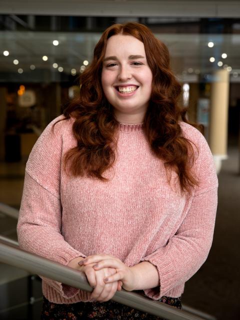 Erica Gaetz, human development and family services graduate, pictured in the Memorial Student Center grand stairwell.