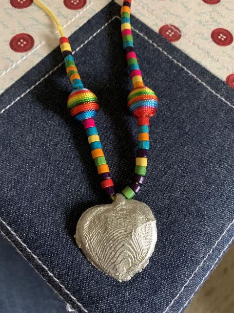 A necklace made by one of the castings done in the cul-de-sac.
